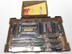 A collection of N gauge diecast locomotives, in plastic boxes.