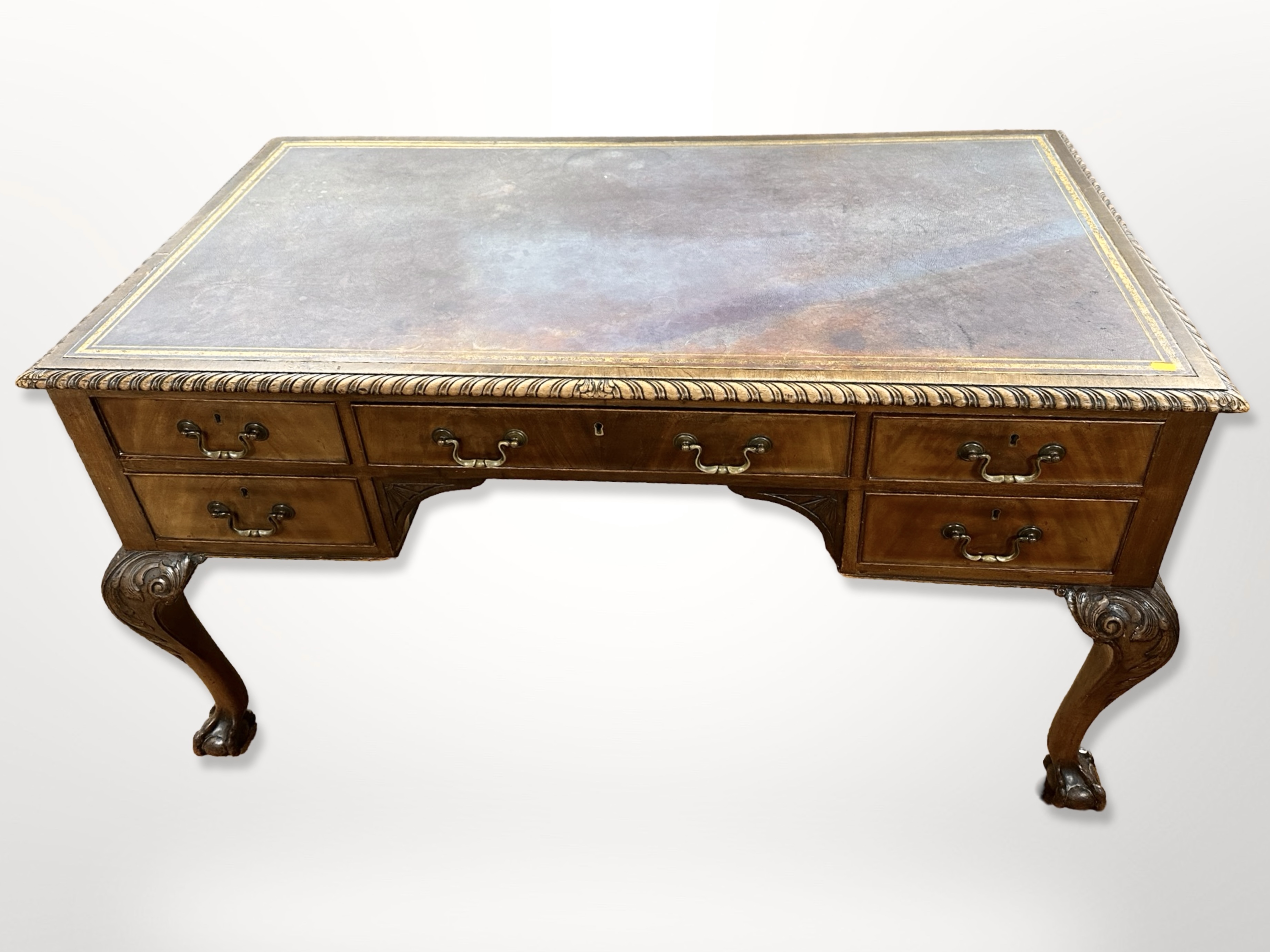 A late Victorian walnut writing desk, fitted five drawers to each side,