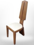 A teak panel back chair