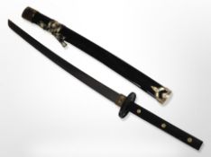 A reproduction katana in sheath, blade 50cm.