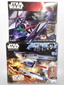 Two Hasbro Disney Star Wars figures, Rebel U-Wing Fighter and Tie Fighter, boxed.
