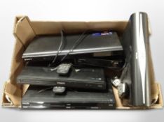 A group of Philips and Sony DVD players, Sky+ HD box with leads and remotes.