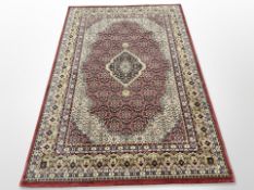 A machine-made rug of Persian design,