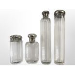 Four silver-topped crystal dressing table bottles, tallest 17.