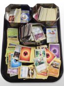 A collection of Pokémon cards in three tins.