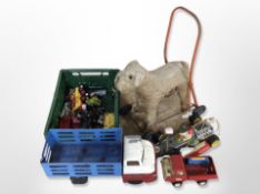 A child's vintage push-along mohair dog, together with other toys, including diecast Tonka truck,