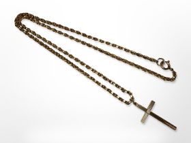 A 9ct gold crucifix pendant on a chain measuring 50cm CONDITION REPORT: 12.