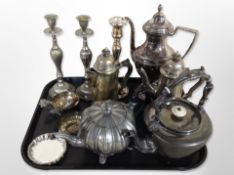 A group of silver-plated candlesticks and teapots, pewter teapot, pair of wine tasting cups, etc.