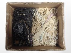 A box of mixed faux pearl necklaces, hematite jewellery, etc.