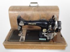A Pfaff hand sewing machine, in case.