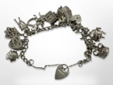 A silver charm bracelet CONDITION REPORT: 70.