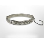 An engraved silver bangle, inner diameter 6cm CONDITION REPORT: 14.
