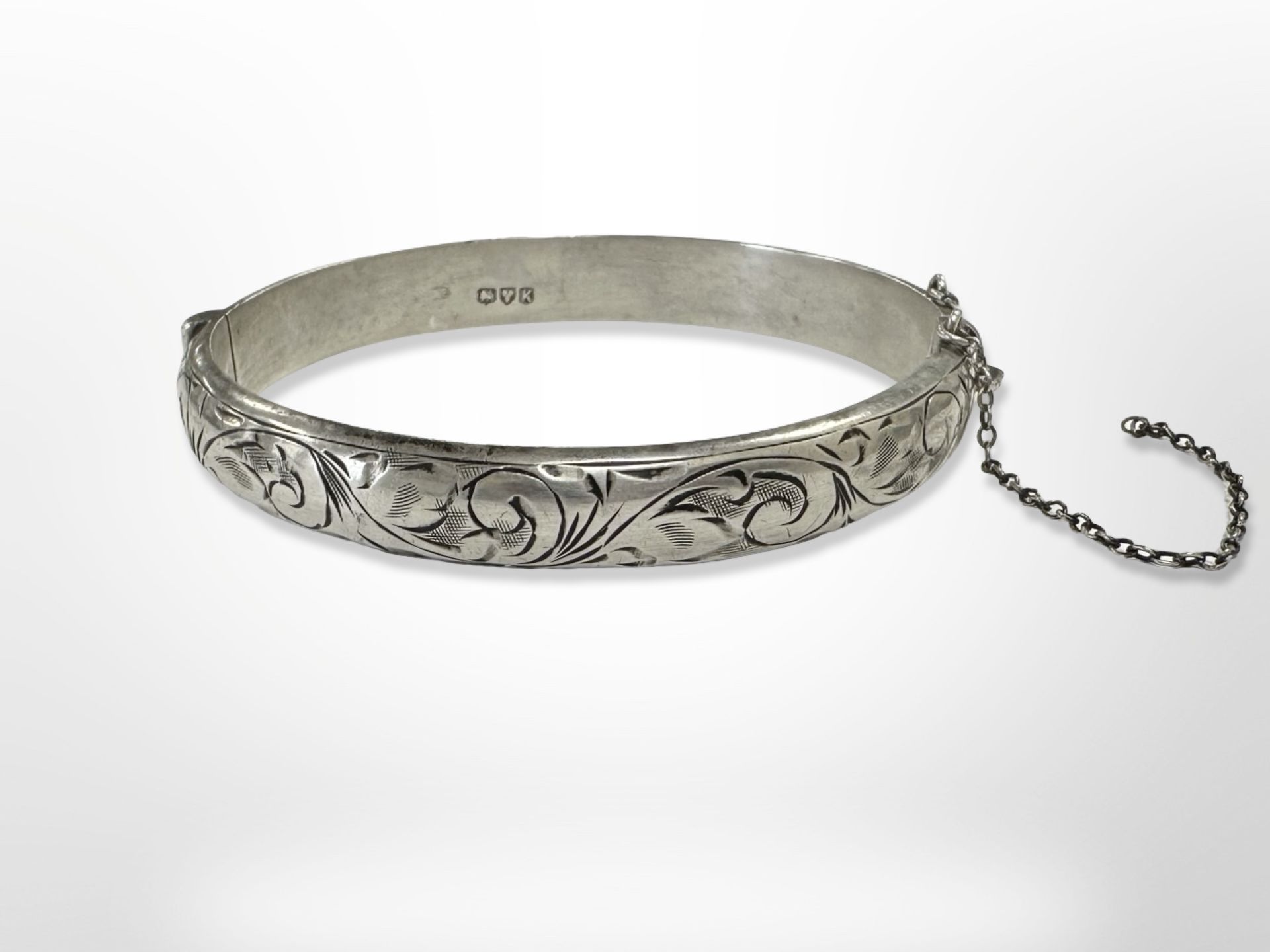 An engraved silver bangle, inner diameter 6cm CONDITION REPORT: 14.