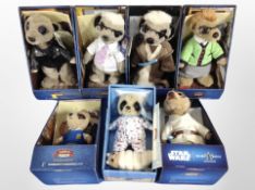 A group of CompareTheMeerkat soft toys, in boxes.
