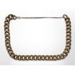 An antique 9ct gold curb-link bracelet with chased decoration,
