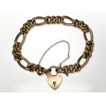 An antique 9ct gold padlock bracelet with ornate engraved links CONDITION REPORT:
