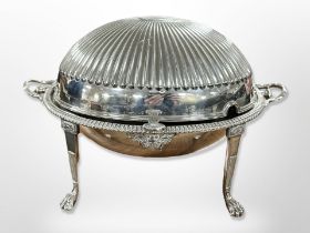 A silver-plated dome top revolving food cover on paw feet, width 35cm.