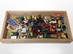 A pine tray containing assorted unboxed vintage diecast vehicles and other models.