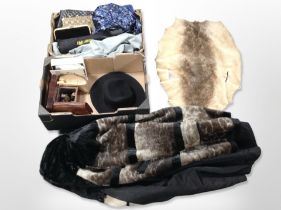 A synthetic fur coat, lady's handbags, other clothing.