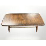 An Ercol stained elm coffee table with undershelf, 105cm long x 44cm wide x 36cm high.