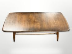 An Ercol stained elm coffee table with undershelf, 105cm long x 44cm wide x 36cm high.
