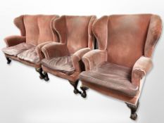 An early 20th century three piece lounge suite : two seater wing back settee and matching pair of