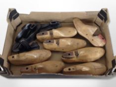 A group of cast-iron and carved wooden shoe stretchers.