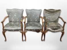 Three early 20th century carved beech framed armchairs in floral satin fabric