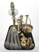 An early 20th-century brass oil lamp base with clear glass reservoir,