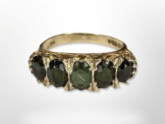 A 9ct gold five stone green tourmaline ring, size N CONDITION REPORT: 3.