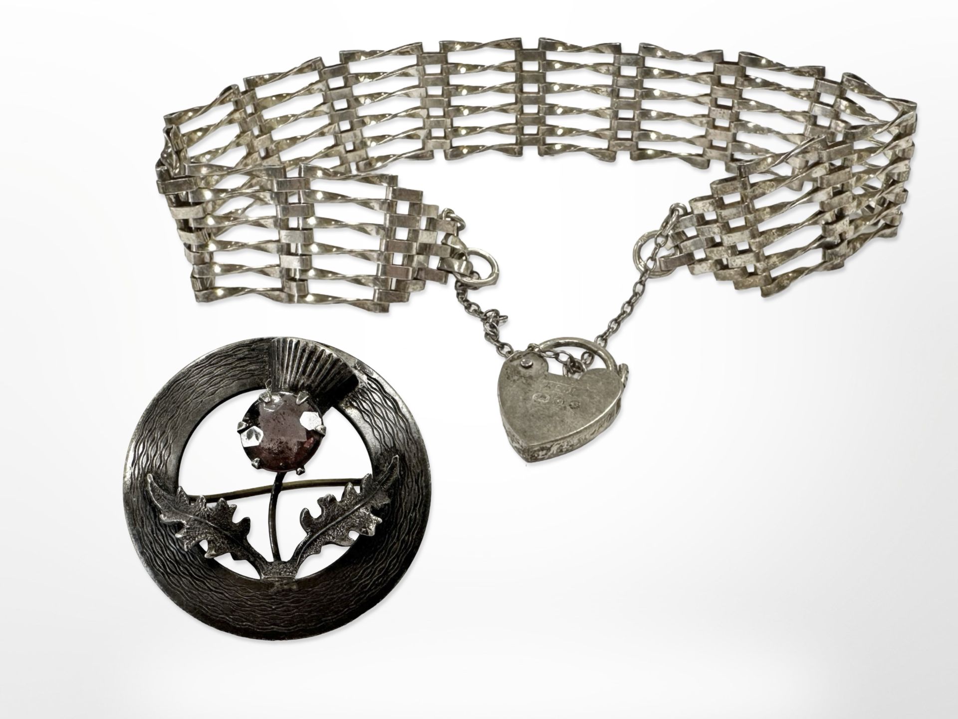 A Scottish silver brooch plus a padlock bracelet CONDITION REPORT: 19.