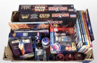 A group of Star Wars and Star Trek collectibles including Star Wars Monopoly games, books, figures,