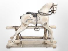 A Victorian carved pine child's rocking horse, as found, length 90cm.