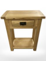 A contemporary oak single drawer side table,