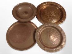 Three copper plates, largest 34cm diameter.