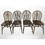 Two pairs of oak wheel back dining chairs