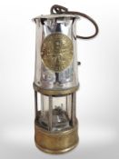 A chrome Eccles Type 6RS miner's safety lamp.