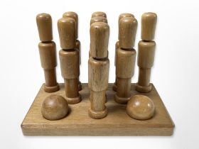 A wooden bar top skittles game