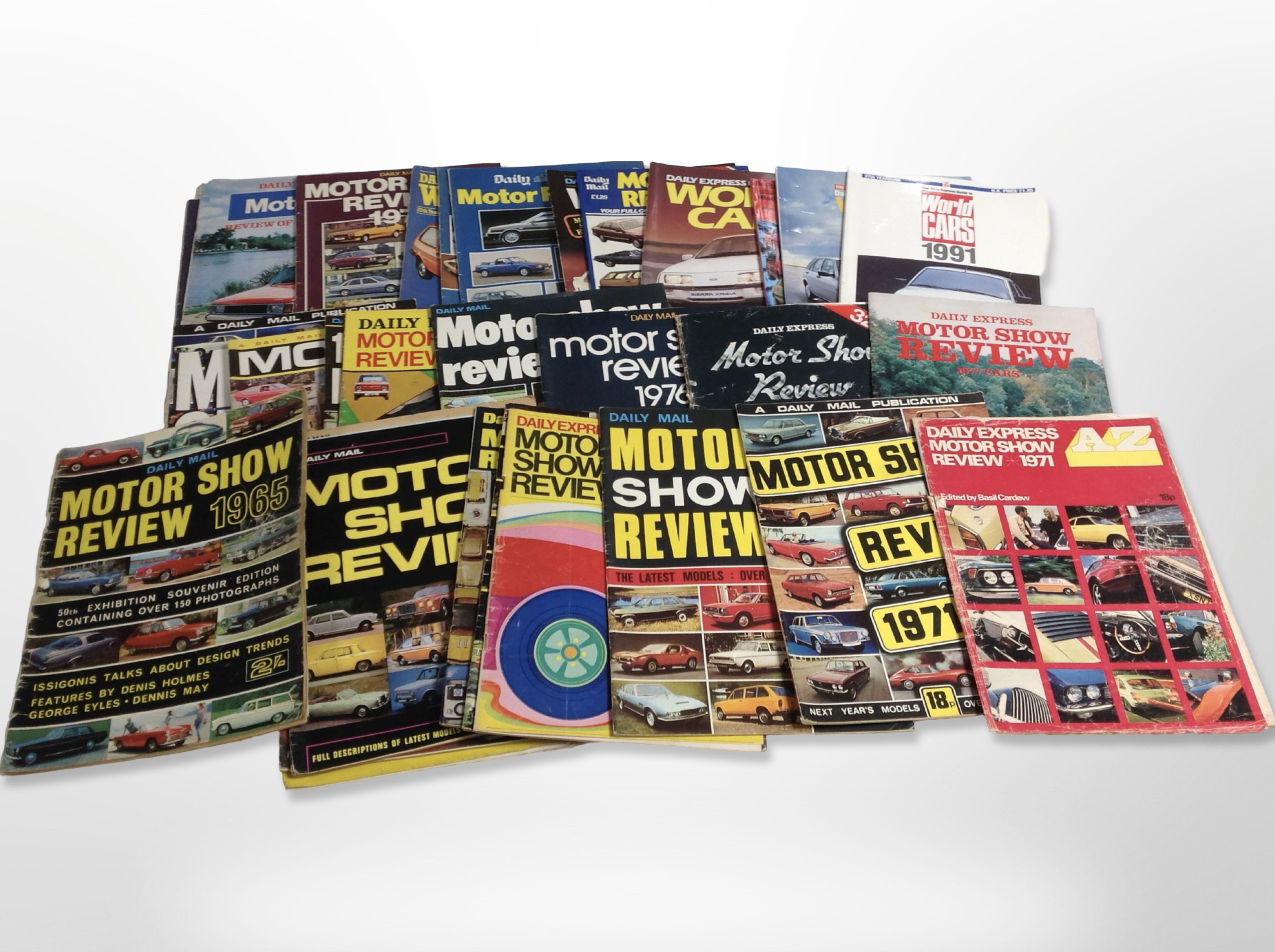 A collection of 33 Daily Mail Motorshow Review magazines from 1965-1991.