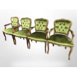A set of four carved salon armchairs in green studded fabric