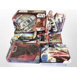 Seven Hasbro and Disney Store Star Wars figures, boxed.