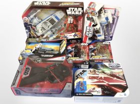 Seven Hasbro and Disney Store Star Wars figures, boxed.