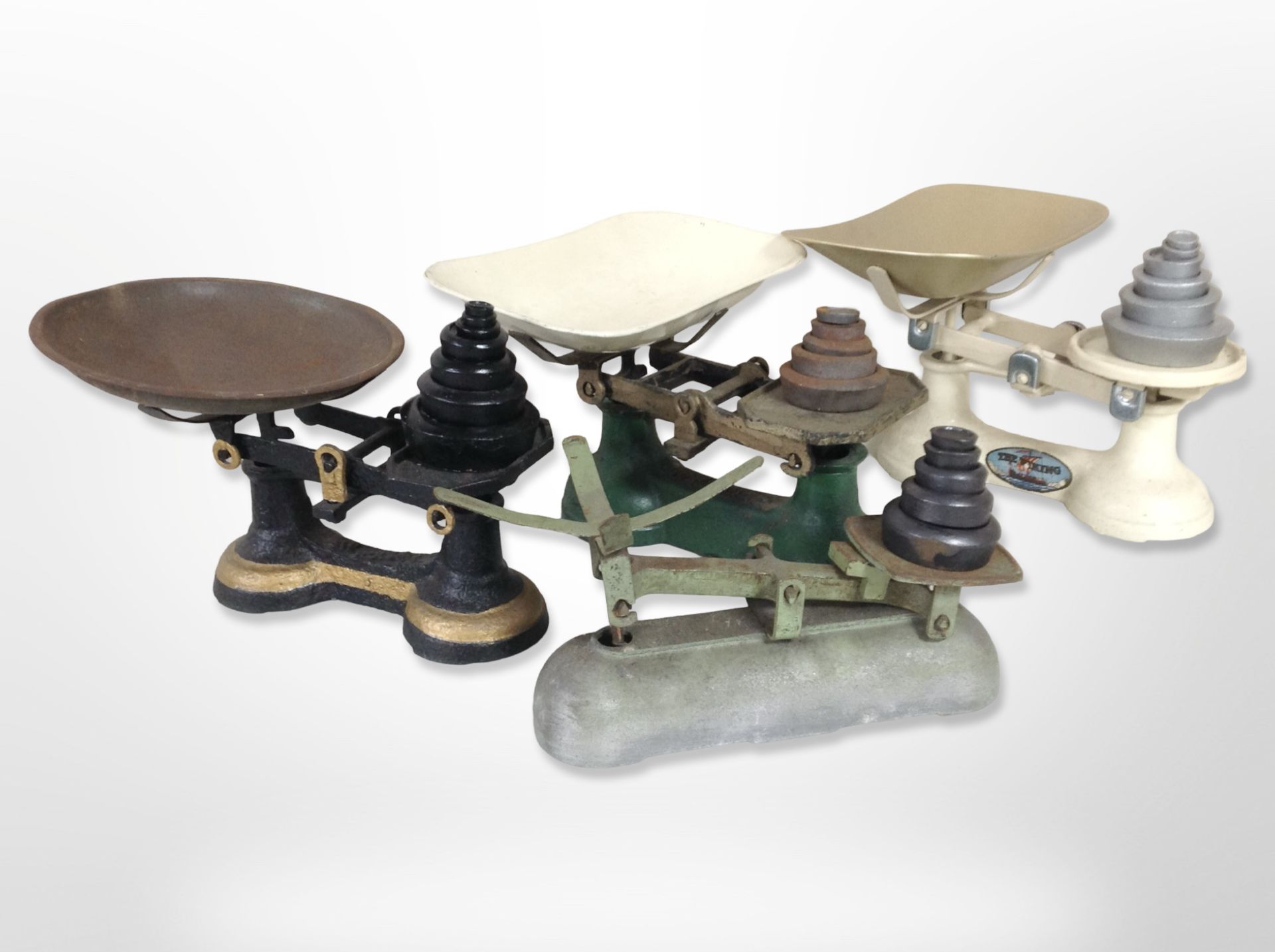 A group of antique enamelled cast-iron scales with weights.