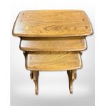 An Ercol stained elm nest of three tables, width 57cm.