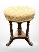 A late-Victorian mahogany circular footstool, height 49cm.
