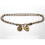 A 9ct yellow gold double strand bracelet with heart padlock CONDITION REPORT: 5.3g.
