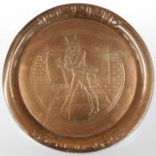 A copper Johnnie Walker plate,