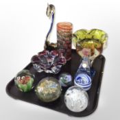 A group of studio glass paperweights, bowls, figure of a swan, two-tone perfume bottle, etc.