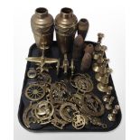 A group of horse brasses, pair of vases, candlesticks, model cannon, inert artillery shells, etc.