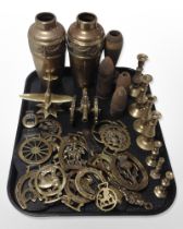 A group of horse brasses, pair of vases, candlesticks, model cannon, inert artillery shells, etc.